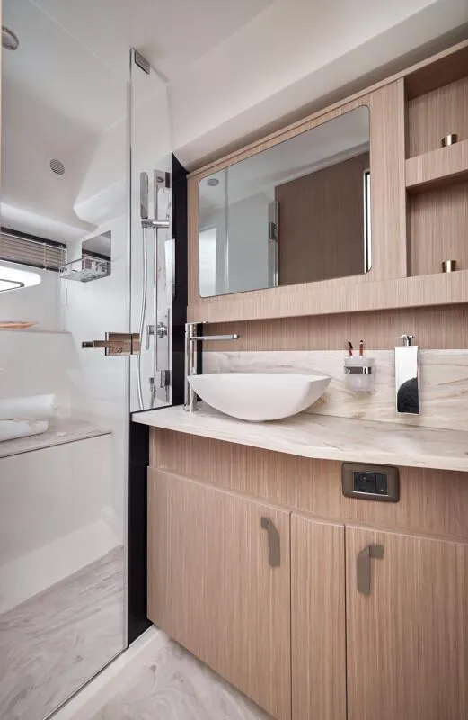 Slide: The Image of Luxurious bathroom interior of 2026 Prestige F5.7 yacht with modern fixtures and wood accents. - 32