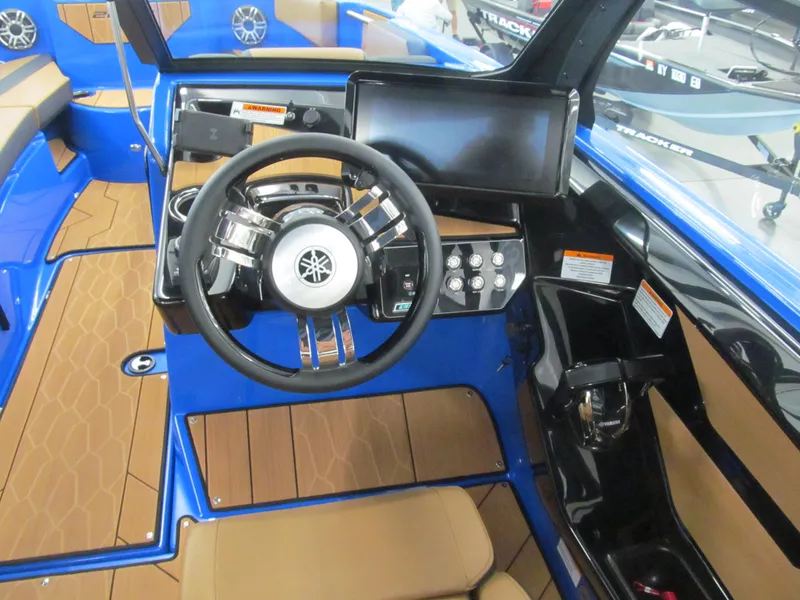Slide: The Image of 2025 Yamaha Boats 222XD cockpit with steering wheel and modern dashboard controls. - 5