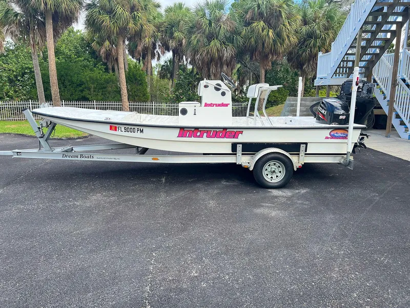 The Image of 2013 Dream Boats C-18 on trailer, parked outdoors near palm trees. - 0