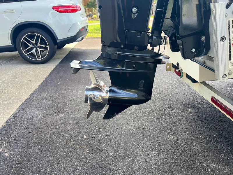 Slide: The Image of Close-up of a 2013 Dream Boats C-18 motor propeller on a trailer. - 13