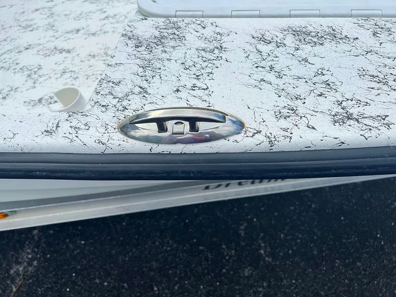 Slide: The Image of 2013 Dream Boats C-18 with marbled white finish and chrome detail. - 18