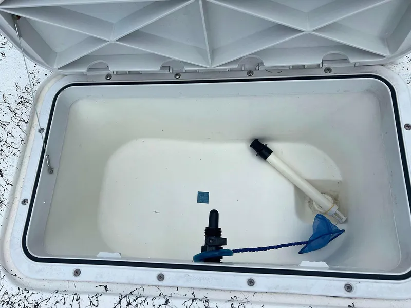 Slide: The Image of Open storage compartment in 2013 Dream Boats C-18 model. - 20