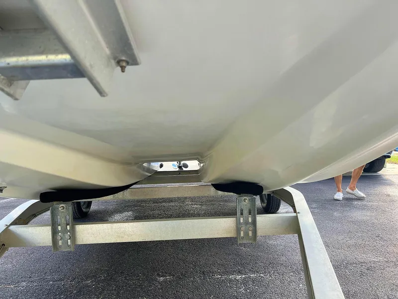 Slide: The Image of 2013 Dream Boats C-18 hull on trailer, close-up view. - 25