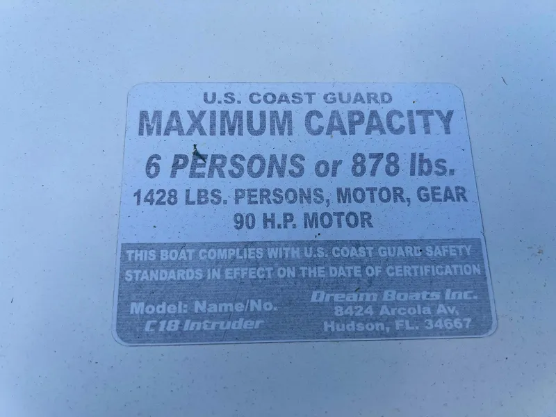 Slide: The Image of U.S. Coast Guard capacity label for Dream Boats C-18, 2013 model, 6 persons or 878 lbs. - 29