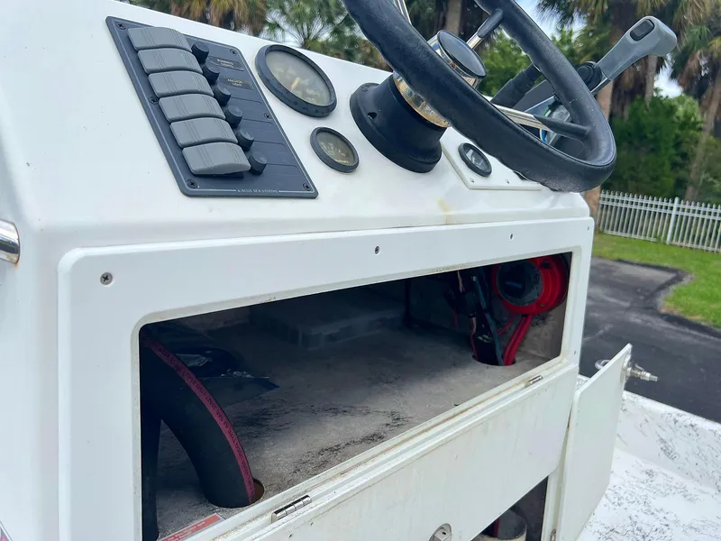 Slide: The Image of 2013 Dream Boats C-18 console with steering wheel and control panel. - 3