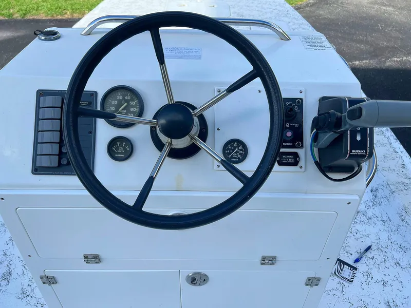 Slide: The Image of Steering console of 2013 Dream Boats C-18 with gauges and controls. - 4