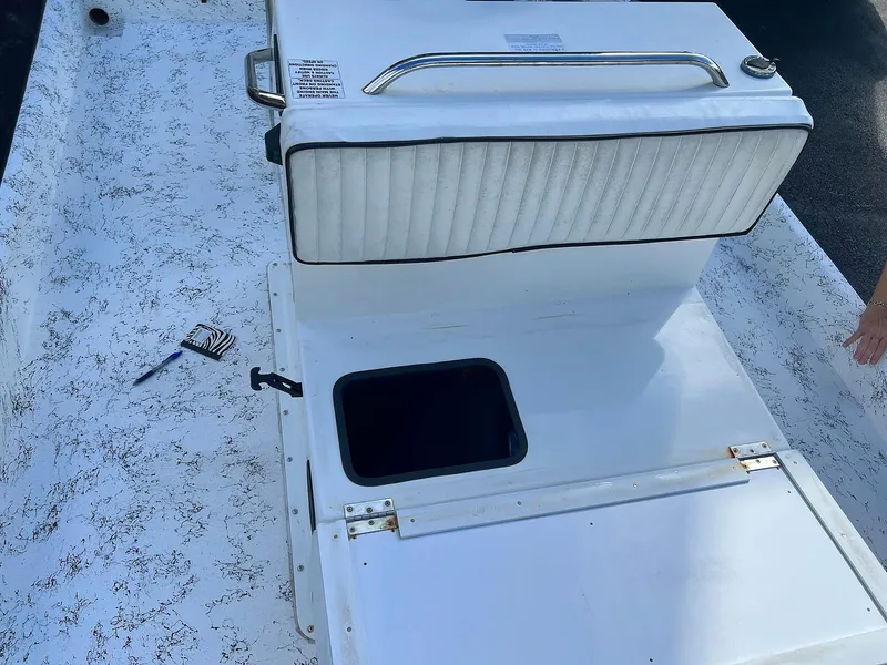 Slide: The Image of 2013 Dream Boats C-18 interior with storage compartment and seat. - 5