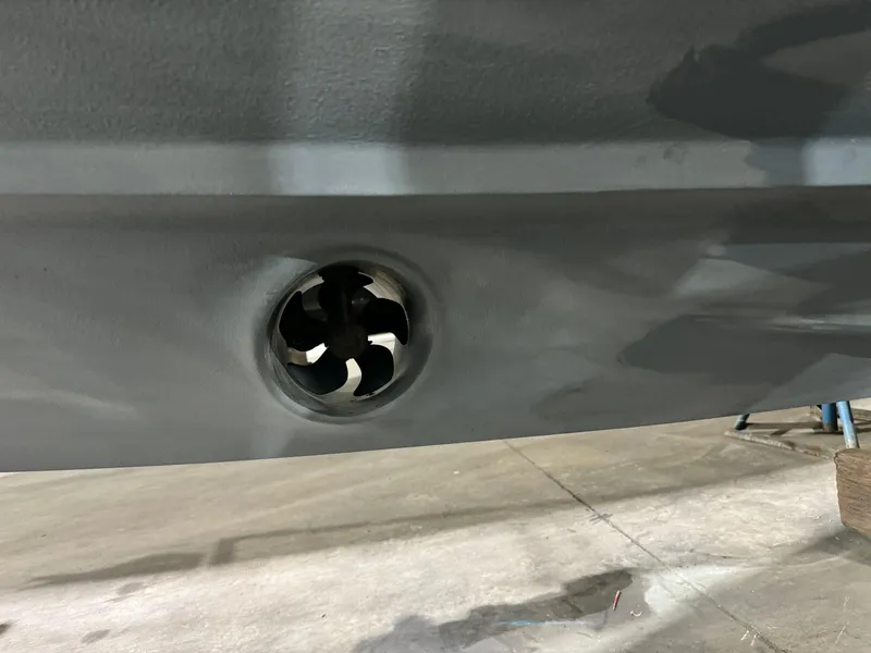 Slide: The Image of 2020 Axopar 37 Cross Cabin BRABUS boat hull on stands in a workshop. - 12