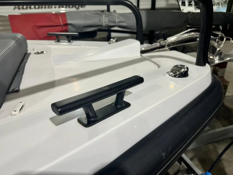 Slide: The Image of 2020 Axopar 37 Cross Cabin BRABUS with twin Mercury 350 engines in a showroom. - 18