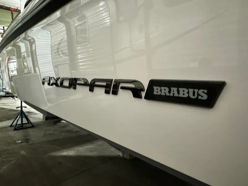 Slide: The Image of 2020 Axopar 37 Cross Cabin BRABUS in a workshop, side view of hull detailing. - 20