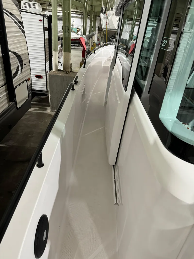 Slide: The Image of 2020 Axopar 37 Cross Cabin BRABUS in a storage facility, side view. - 27