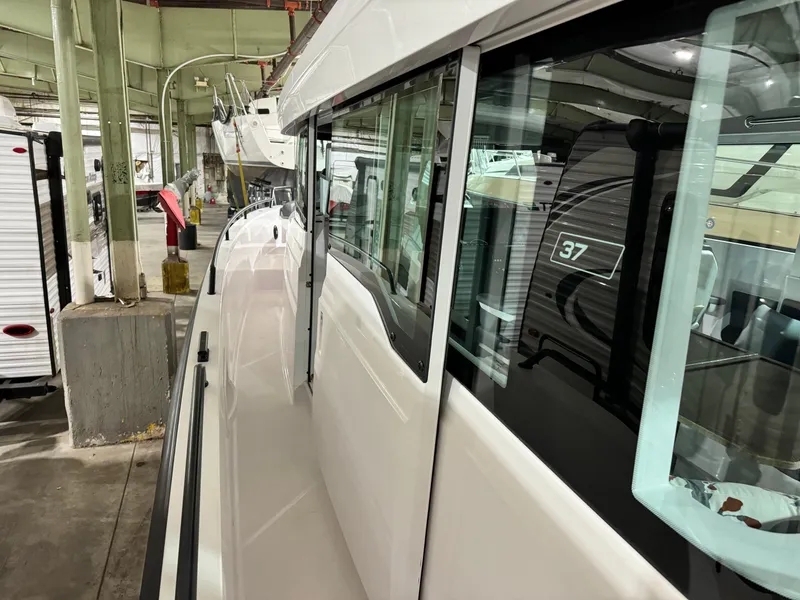 Slide: The Image of Open storage compartment in 2020 Axopar 37 Cross Cabin BRABUS boat. - 28