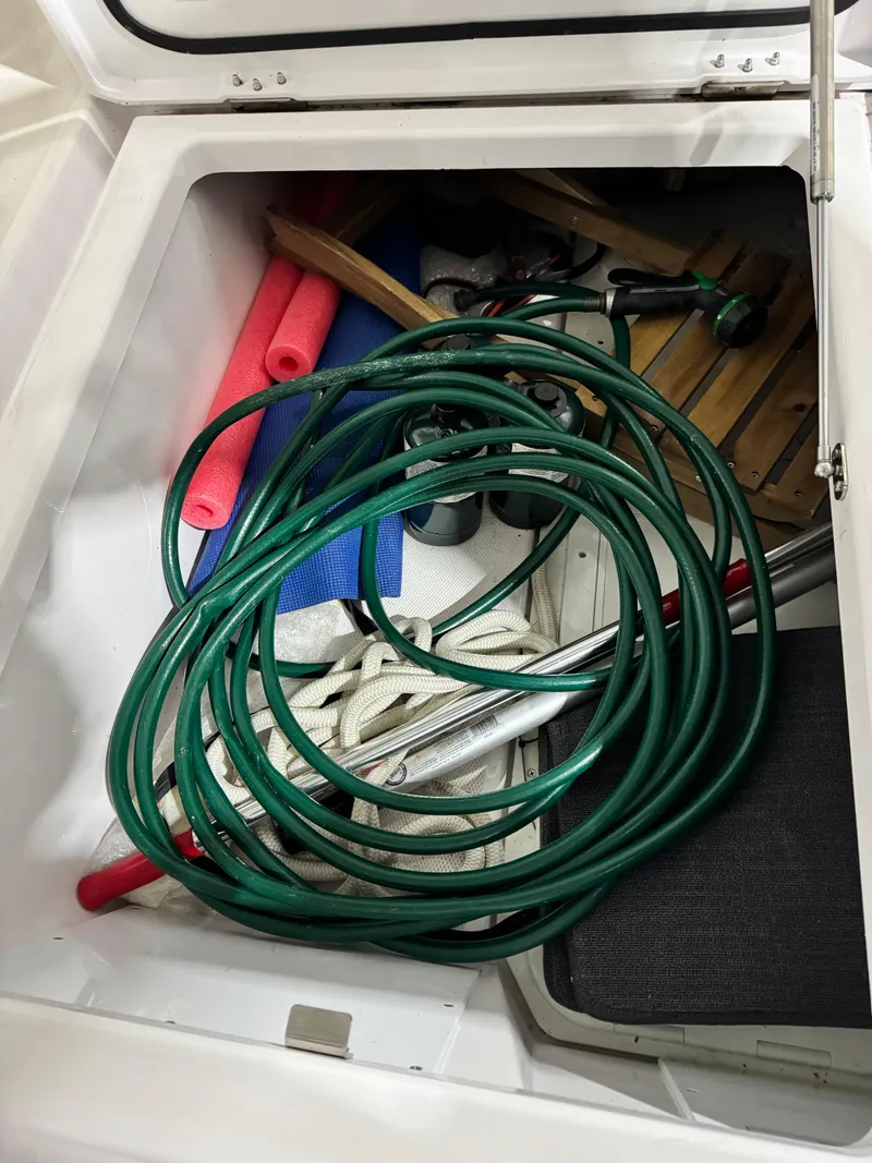 Slide: The Image of Storage compartment of 2020 Axopar 37 Cross Cabin BRABUS with boat equipment and accessories. - 39