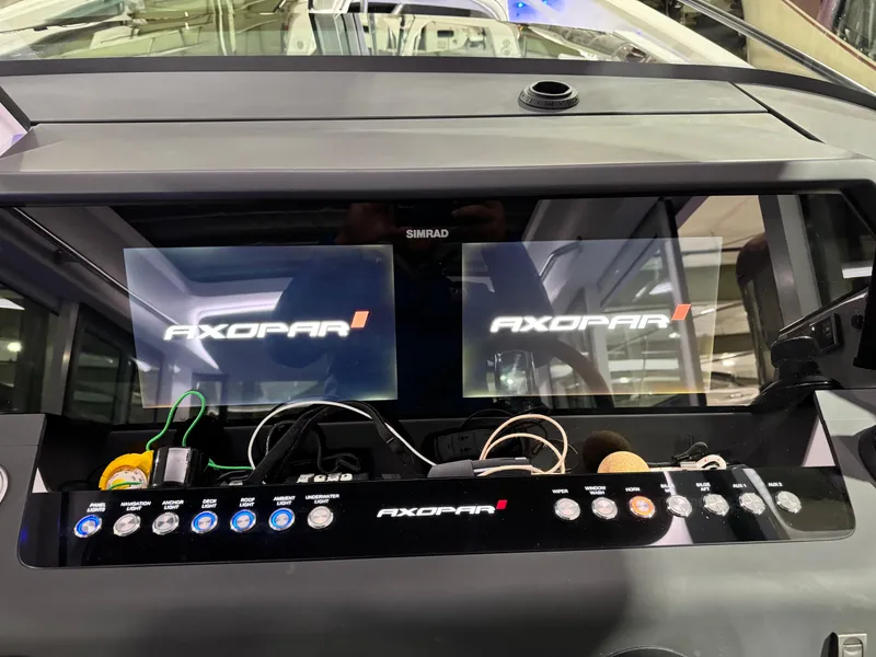 Slide: The Image of 2020 Axopar 37 Cross Cabin BRABUS helm with modern controls and dual displays. - 42