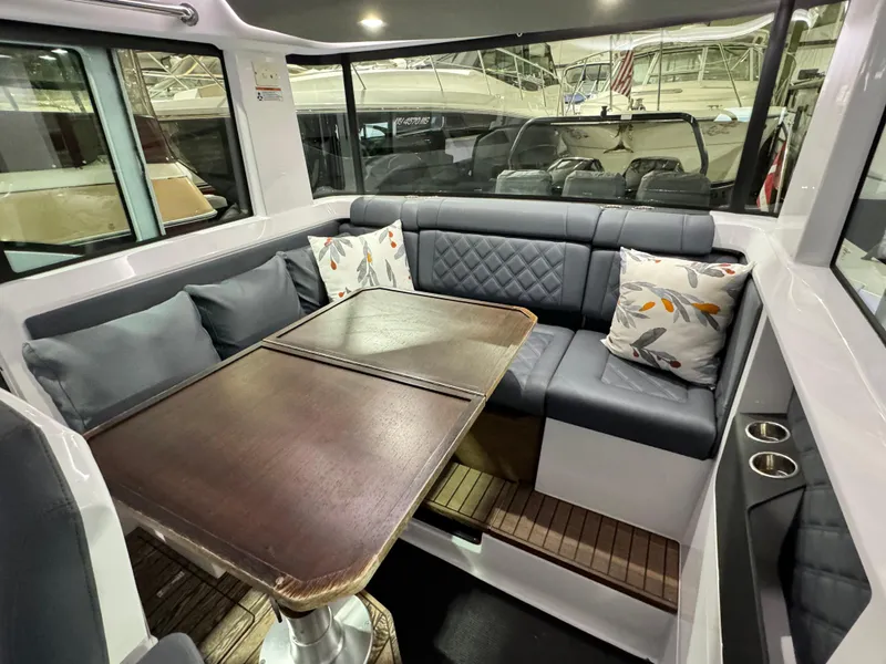 Slide: The Image of Interior of 2020 Axopar 37 Cross Cabin BRABUS with seating and table. - 44
