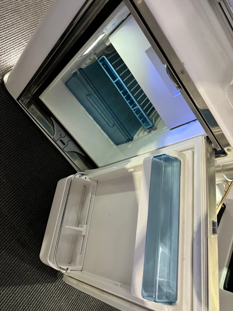 Slide: The Image of Stainless steel refrigerator in 2020 Axopar 37 Cross Cabin BRABUS boat interior. - 48
