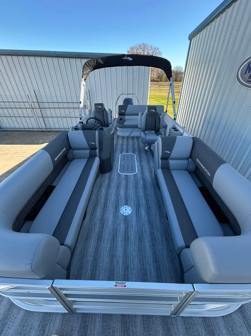 Slide: The Image of 2025 Bennington S 22 pontoon boat with spacious seating and modern design. - 4