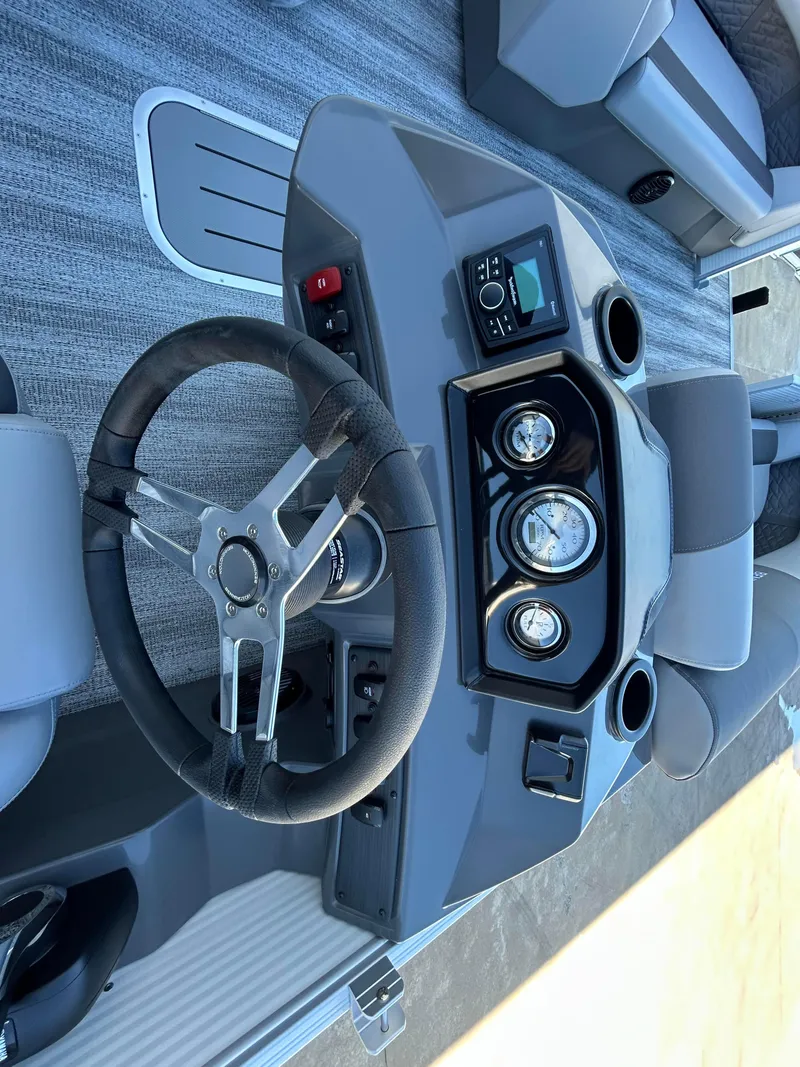Slide: The Image of 2025 Bennington S 22 boat dashboard with steering wheel and gauges. - 7