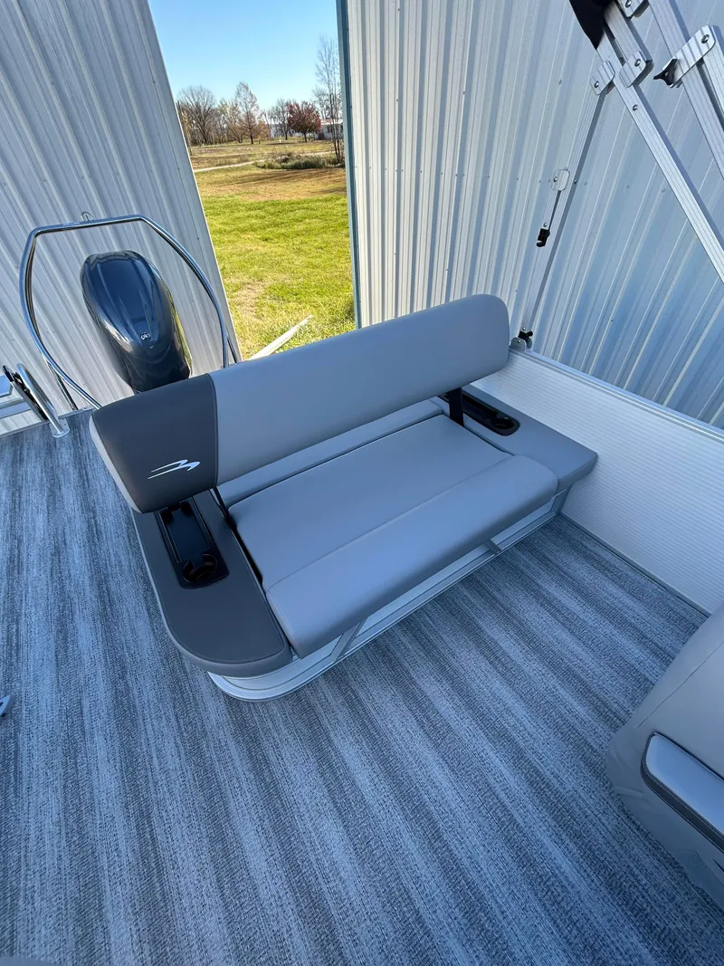 Slide: The Image of 2025 Bennington S 22 boat interior with gray seating and striped flooring. - 8