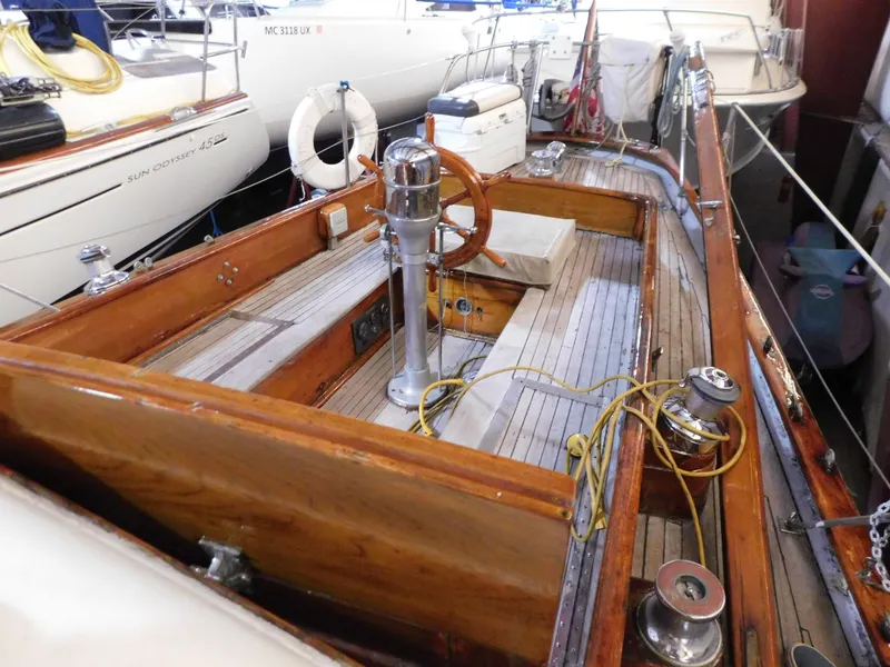 Slide: The Image of 1949 Burger Full Keel Steel Auxiliary Ketch with wooden deck and classic steering wheel. - 10