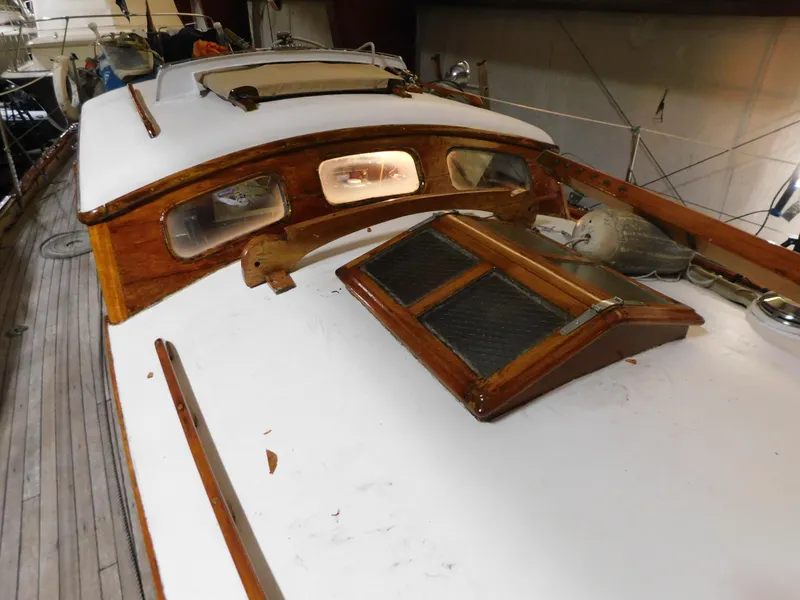 Slide: The Image of 1949 Burger Full Keel Steel Auxiliary Ketch deck with wooden cabin details. - 16