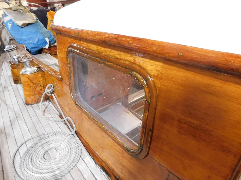 Slide: The Image of 1949 Burger Full Keel Steel Auxiliary Ketch with wooden cabin and deck details. - 18