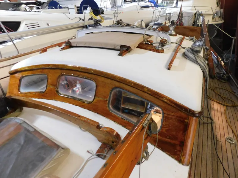 Slide: The Image of 1949 Burger Full Keel Steel Auxiliary Ketch with wooden deck and cabin details. - 19