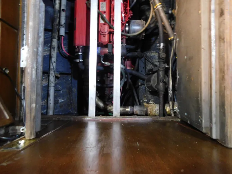 Slide: The Image of Engine room of a 1949 Burger Full Keel Steel Auxiliary Ketch, showcasing mechanical components. - 32