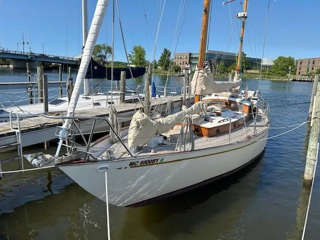 Slide: The Image of 1949 Burger Full Keel Steel Auxiliary Ketch docked at a marina. - 35