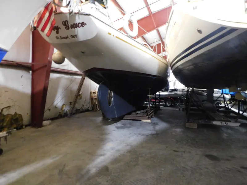 Slide: The Image of 1949 Burger Full Keel Steel Auxiliary Ketch in indoor storage, side view. - 4