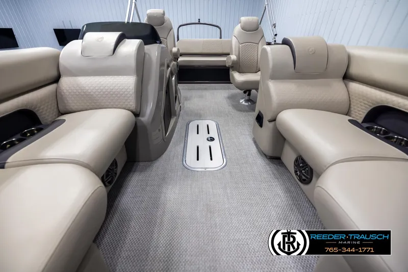 Slide: The Image of Luxurious interior of 2022 Premier 210 Sunsation pontoon boat with beige seating. - 13