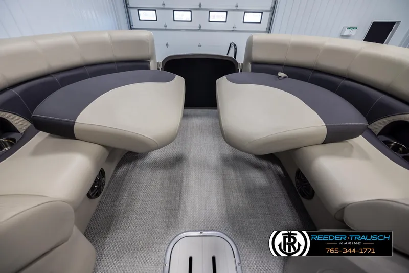 Slide: The Image of 2022 Premier 210 Sunsation boat interior with beige and gray seating. - 20