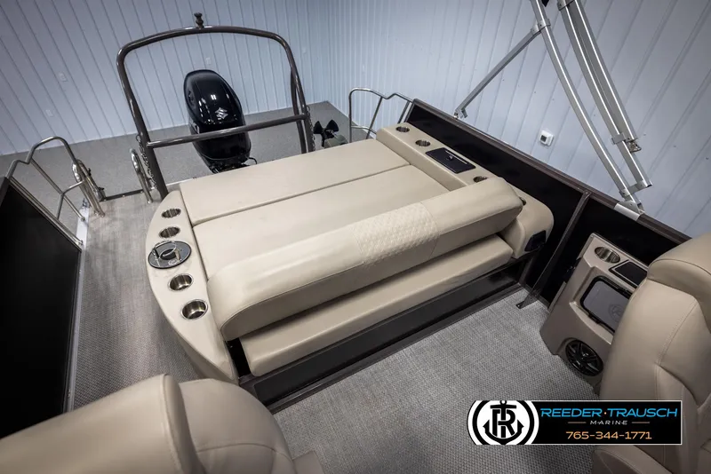 Slide: The Image of 2022 Premier 210 Sunsation boat interior with beige seating and modern design. - 23