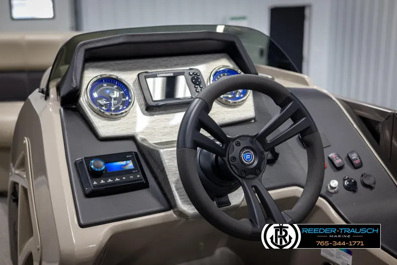 Slide: The Image of Premier 210 Sunsation 2022 boat dashboard with steering wheel and gauges. - 26