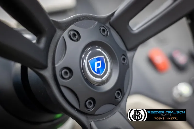 Slide: The Image of Close-up of 2022 Premier 210 Sunsation steering wheel with logo. - 27