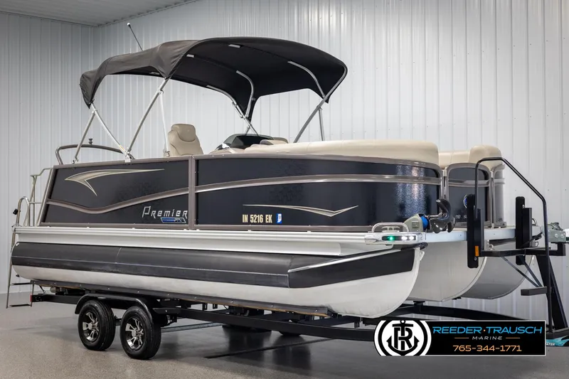Slide: The Image of 2022 Premier 210 Sunsation pontoon boat on trailer in indoor storage. - 3
