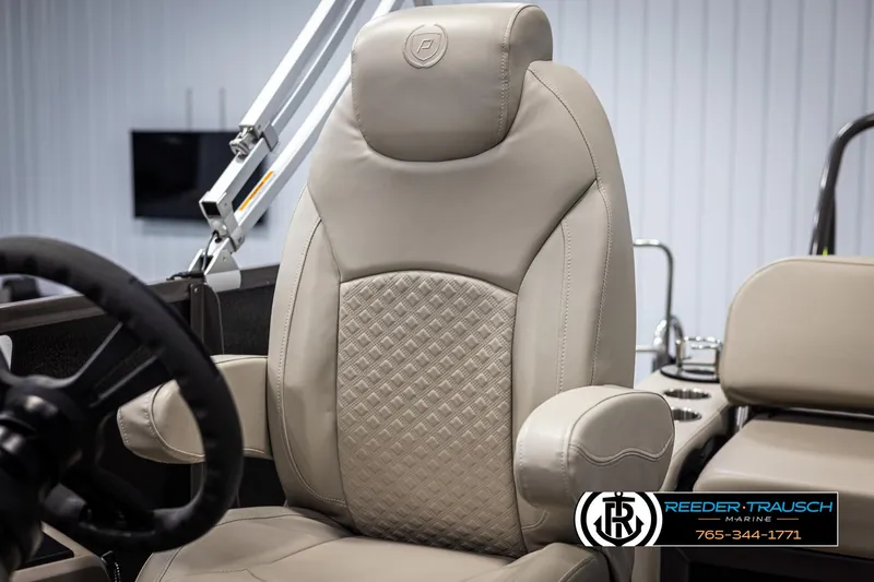 Slide: The Image of Premier 210 Sunsation 2022 boat seat with beige upholstery and diamond pattern design. - 34