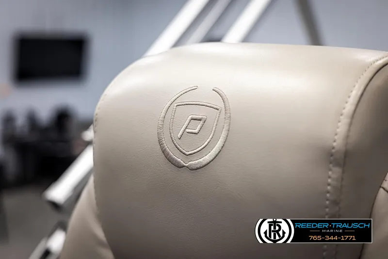 Slide: The Image of Premier 210 Sunsation 2022 boat seat with logo, beige upholstery. - 35
