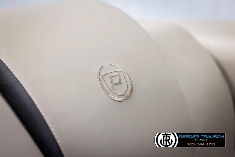 Slide: The Image of Premier 210 Sunsation 2022 boat seat with logo, beige upholstery. - 36