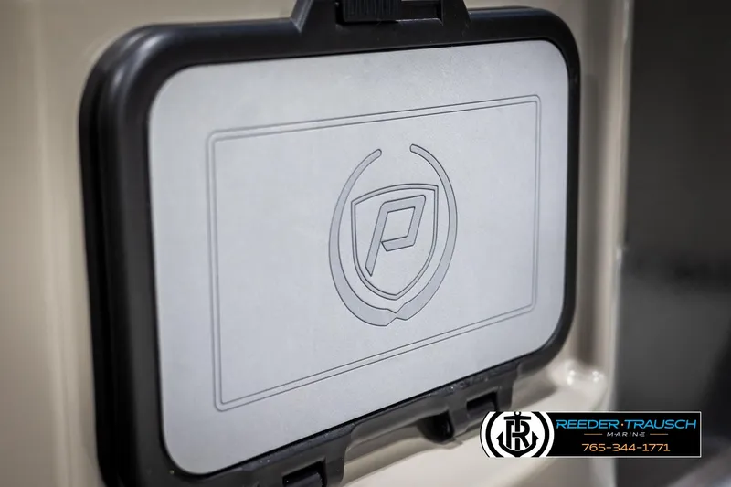 Slide: The Image of Premier 210 Sunsation 2022 boat compartment with logo, Reeder-Trausch Marine branding. - 38