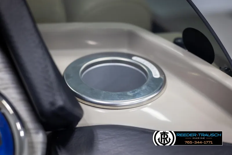 Slide: The Image of 2022 Premier 210 Sunsation boat cup holder detail with Reeder-Trausch Marine logo. - 40