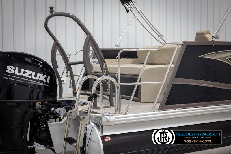 Slide: The Image of 2022 Premier 210 Sunsation pontoon boat with Suzuki engine, featuring comfortable seating. - 47