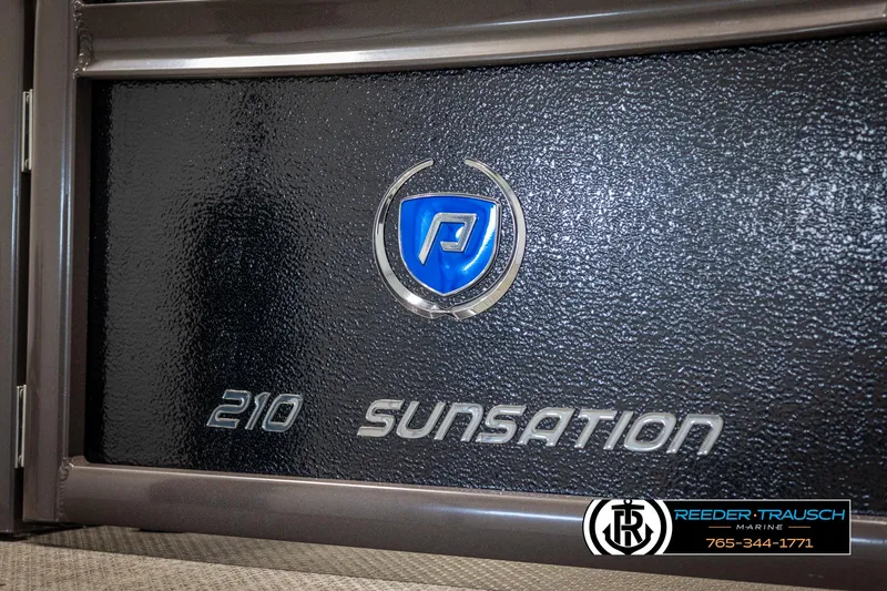 Slide: The Image of 2022 Premier 210 Sunsation logo on black panel with dealership branding. - 49
