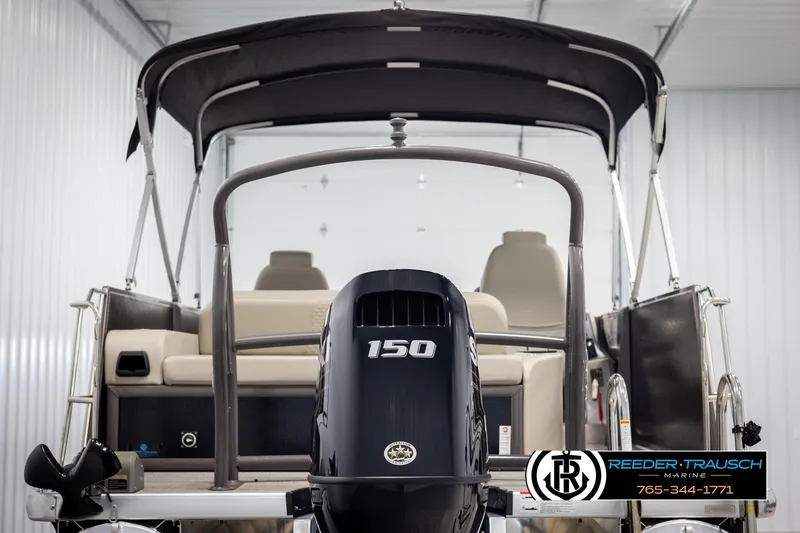 Slide: The Image of 2022 Premier 210 Sunsation pontoon boat with 150 HP engine in showroom. - 7