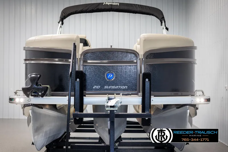 Slide: The Image of 2022 Premier 210 Sunsation pontoon boat on trailer in showroom. - 8