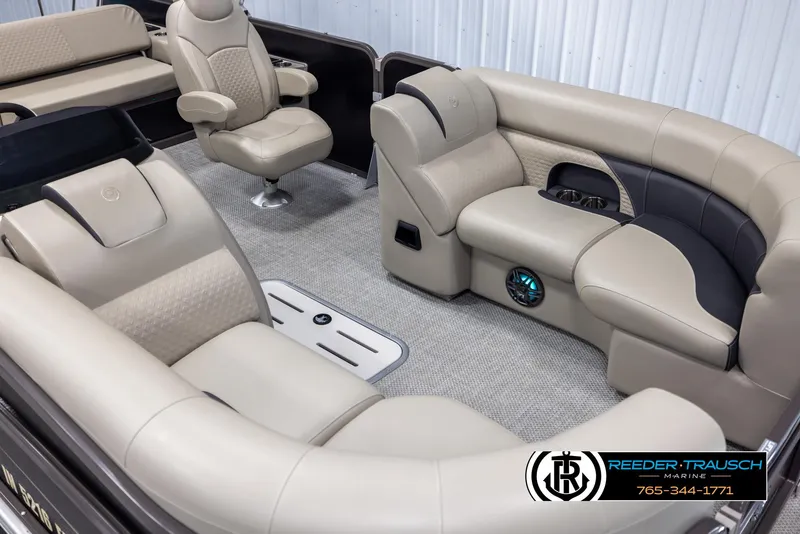 Slide: The Image of Luxurious interior of 2022 Premier 210 Sunsation pontoon boat with plush seating. - 9