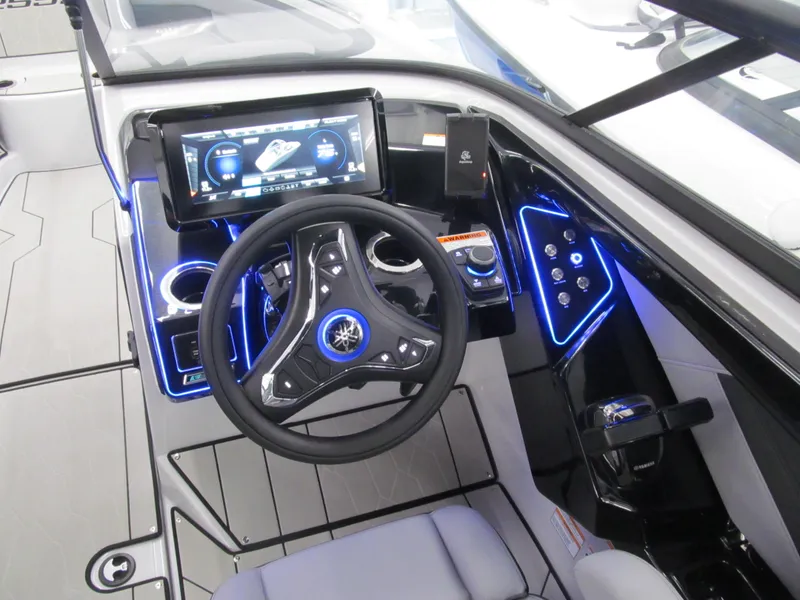 Slide: The Image of 2025 Yamaha Boats 255XD dashboard with illuminated controls and touchscreen display. - 6
