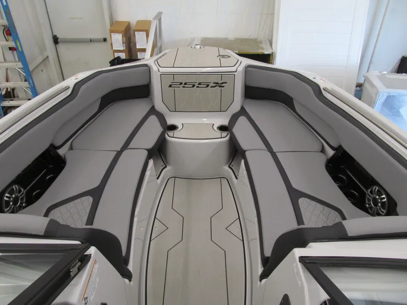 Slide: The Image of 2025 Yamaha Boats 255XD interior with sleek gray seating and modern design. - 7
