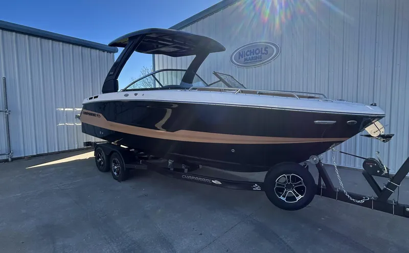 Slide: The Image of 2025 Chaparral 267 SSX boat on trailer outside a building. - 1