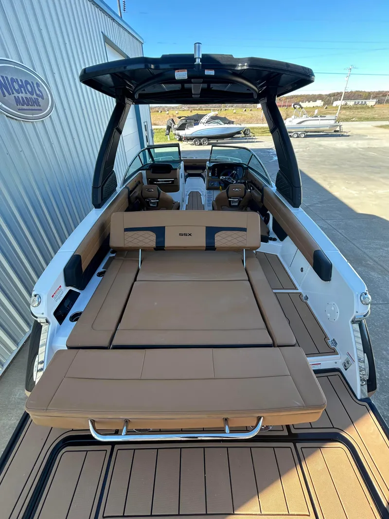 Slide: The Image of 2025 Chaparral 267 SSX boat with spacious deck and luxurious seating. - 4